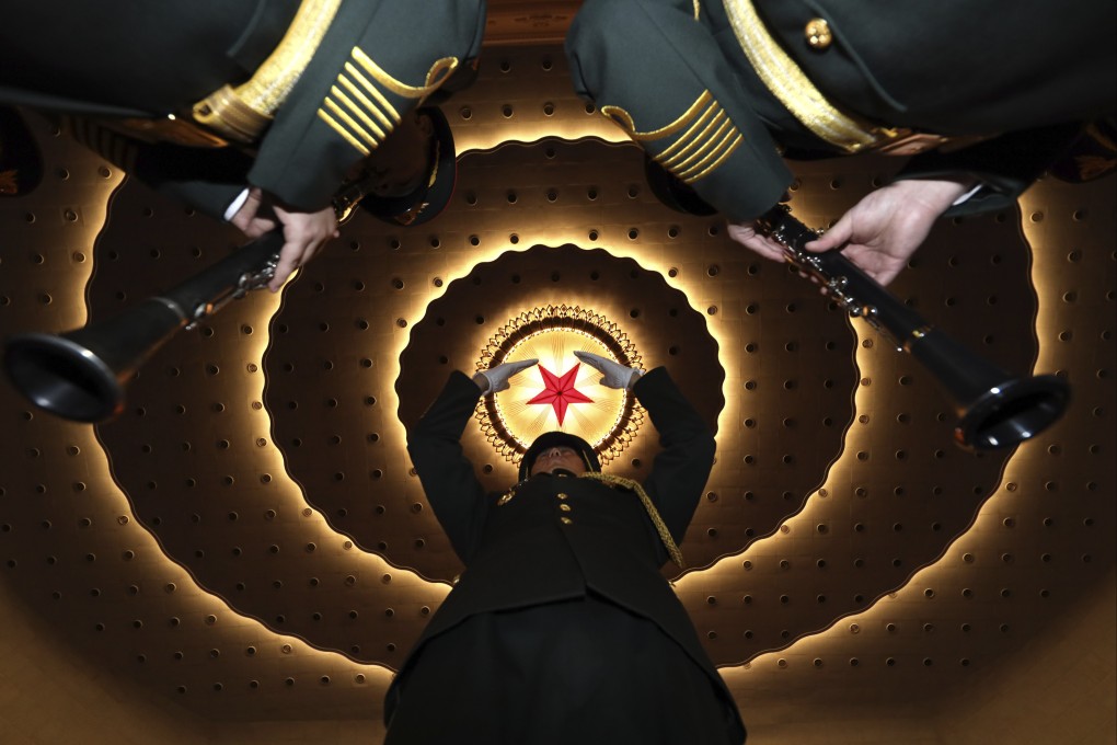 A military band conductor rehearses before the closing session of the National People’s Congress in Beijing’s Great Hall of the People on March 15, 2019. Photo: AP