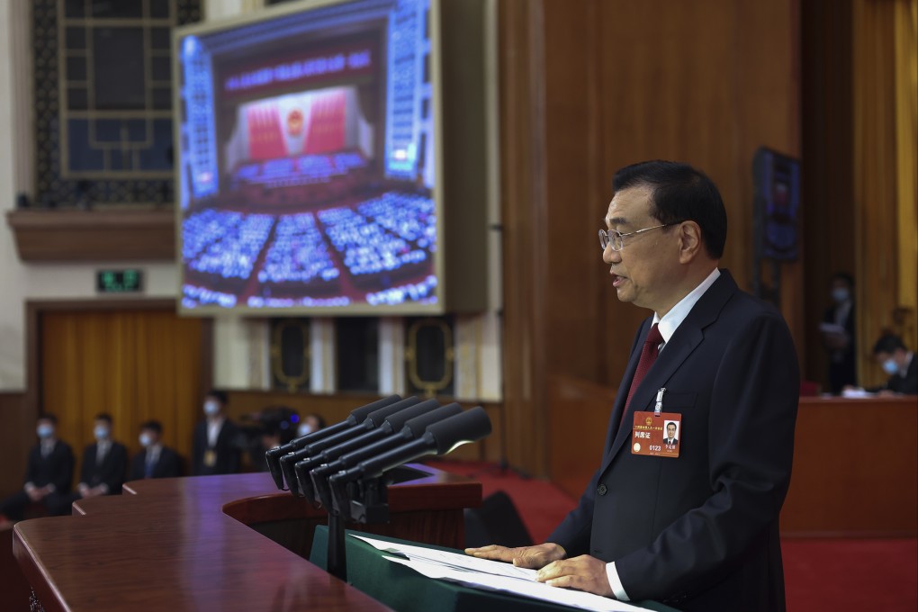 Outgoing Premier Li Keqiang delivers the government’s annual work report at the Great Hall of the People in Beijing on Sunday. Photo: AP