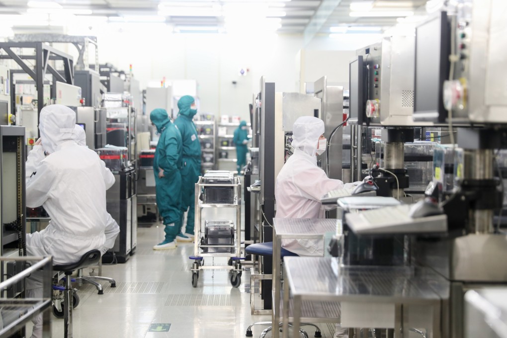 Staff members at a semiconductor workshop in Shanghai on February 10, 2020. Photo: Xinhua