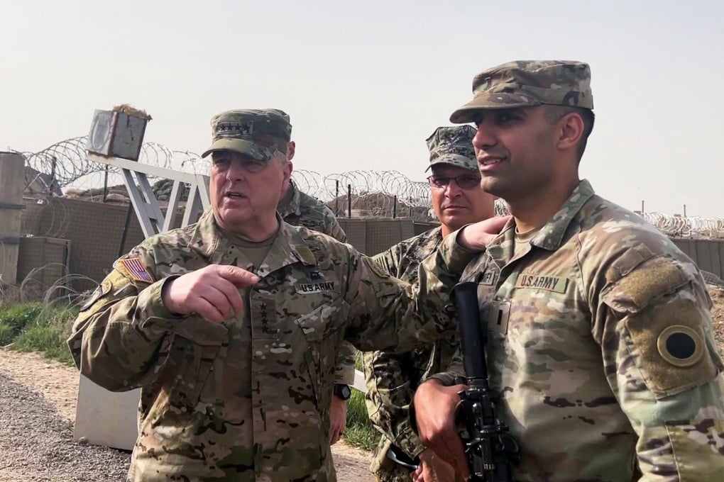 General Mark Milley, left, chairman of the Joint Chiefs of Staff, speaks to US forces in Syria during an unannounced visit at a US military base in northeast Syria on Saturday. Photo: Reuters