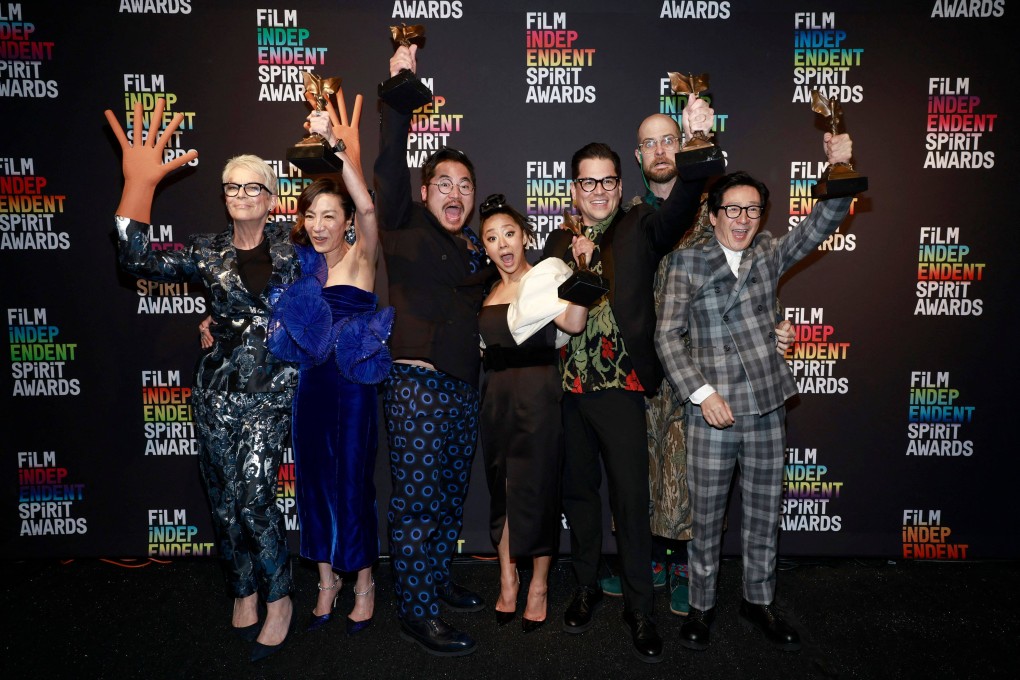 (From left) Jamie Lee Curtis, Michelle Yeoh, Daniel Kwan, Stephanie Hsu, Jonathan Wang, Daniel Scheinert and Ke Huy Quan celebrate the best feature award for Everything Everywhere All at Once during the Spirit Awards on Saturday. Photo: Getty Images/AFP