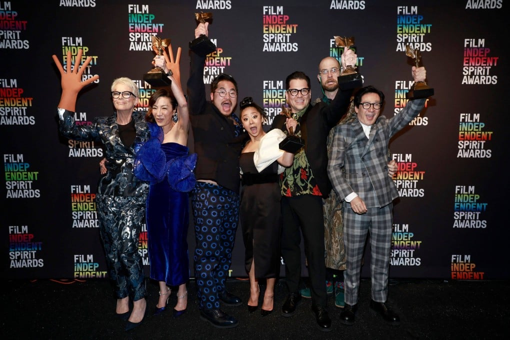 (From left) Jamie Lee Curtis, Michelle Yeoh, Daniel Kwan, Stephanie Hsu, Jonathan Wang, Daniel Scheinert and Ke Huy Quan celebrate the best feature award for Everything Everywhere All at Once during the Spirit Awards on Saturday. Photo: Getty Images/AFP