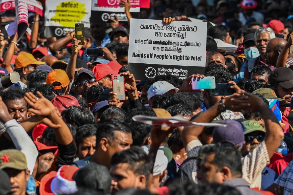 Activists of the opposition National People’s Power (NPP) party take part in a protest held to urge the government to hold local council election as scheduled. Photo: AFP/File