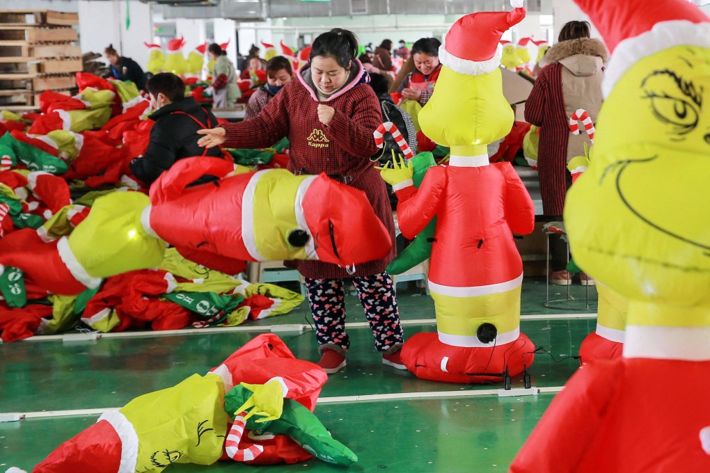 Women work at a factory producing inflatable Grinch toys for export at a factory in Huaibei, in China’s eastern Anhui province, on February 15. The official manufacturing sector’s PMI hit 52.6 in February. Photo: AFP