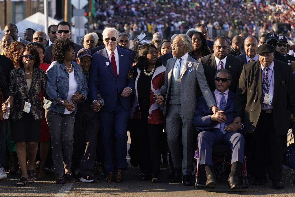 President Joe Biden prepares to walk across the Edmund Pettus Bridge in Selma, Alabama. Photo: AP