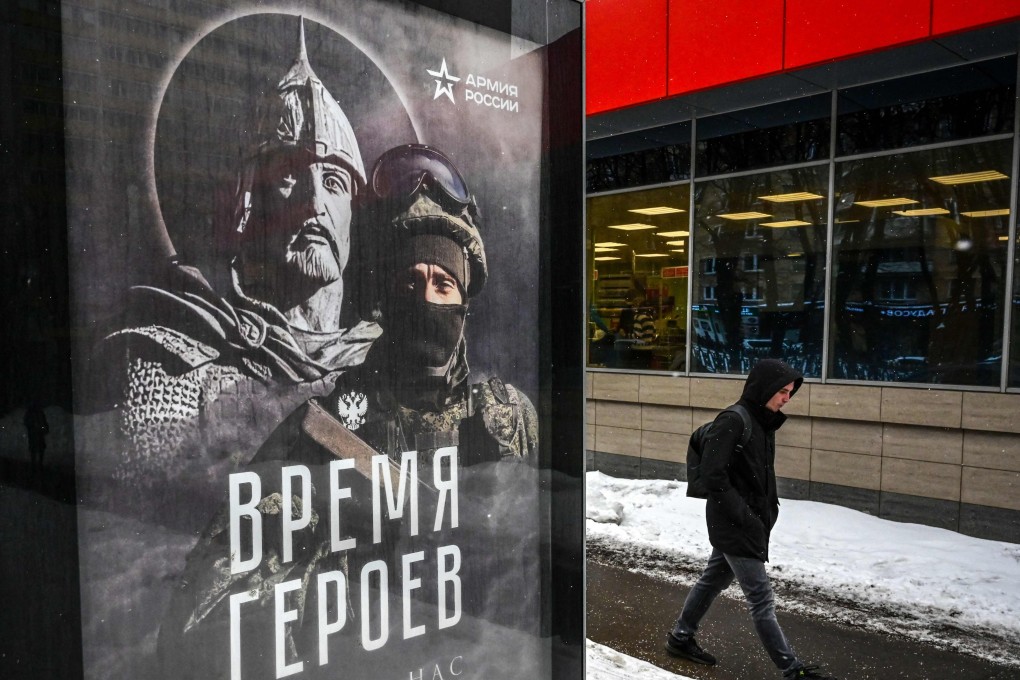 A billboard in Moscow showing a Russian soldier in front of his ancient predecessor. It reads: ‘The Time of Heroes Has Chosen Us’. Photo: AFP