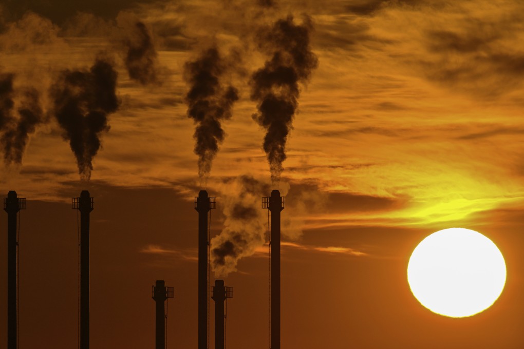 Smoke rises from the chimneys of a combined heat and power plant at Berlin Brandenburg Airport in Schönefeld, Germany, on February 7. Photo: DPA/AP
