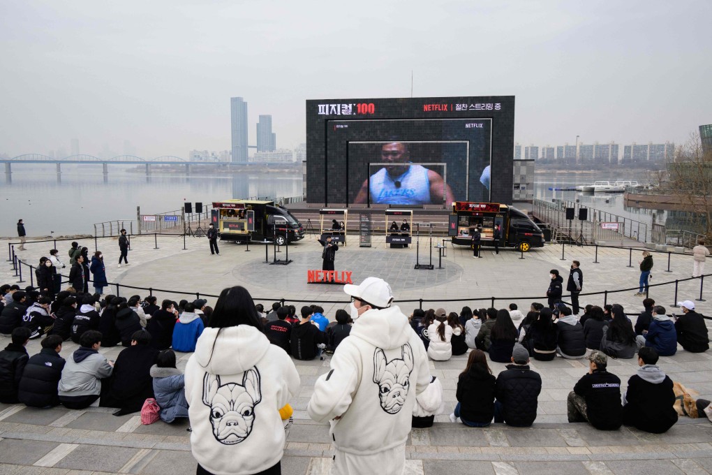 Fans wait for contestants from Physical: 100. Photo: AFP