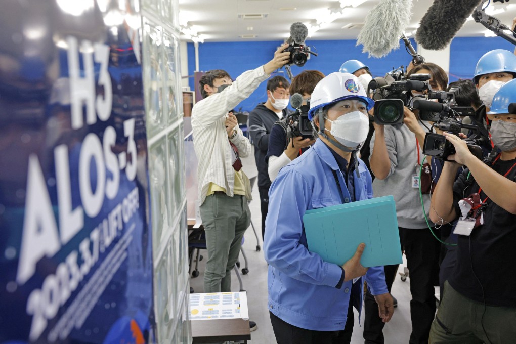 A public relation officer of the Japan Aerospace Exploration Agency (JAXA) explains the launch failure of the H3 rocket to members of the media at Tanegashima Space Centre on Tuesday. Photo: Kyodo via Reuters