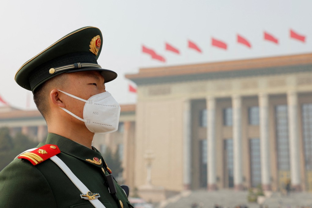 On Sunday, as Chinese Premier Li Keqiang said in his government work report that China would cut its energy intensity and emissions, the Great Hall of the People stood against a backdrop of Beijing pollution. Photo: Reuters