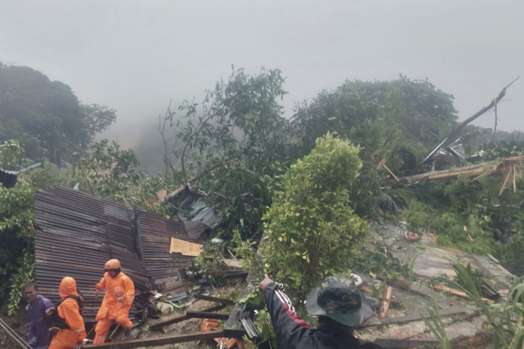 Rescuers search for victims after a landslide on Serasan Island in Indonesia on Monday. Photo: BNPB via AP