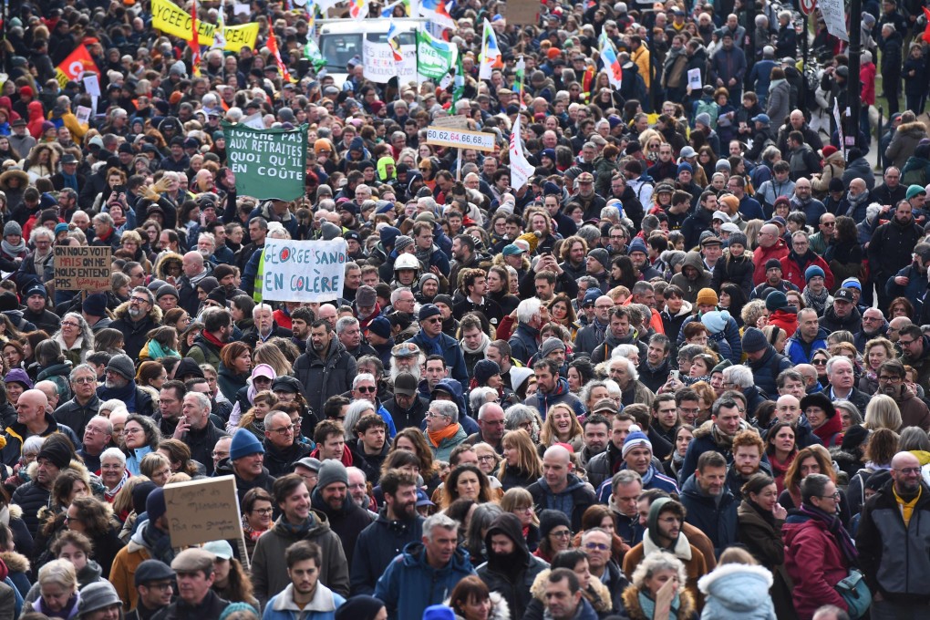 People take part in a demonstration in Nantes, western France, on Tuesday, as part of a nationwide strike day against proposed pension reforms. Photo: AFP
