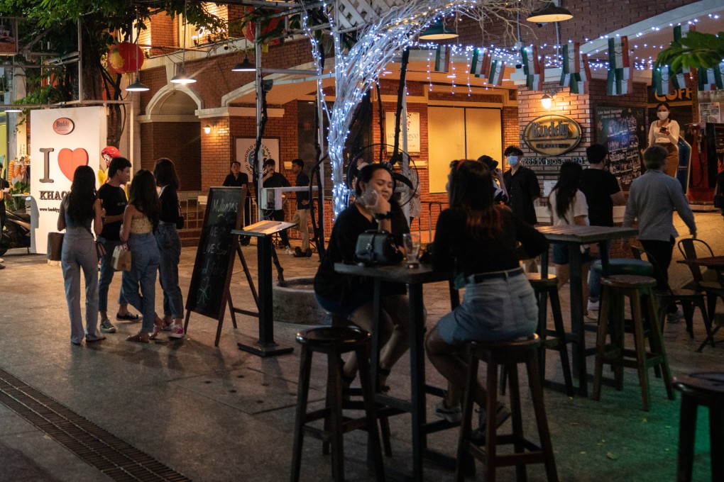Customers have a drink outside a bar on Khaosan Road in Bangkok, Thailand. Photo: Bloomberg/File