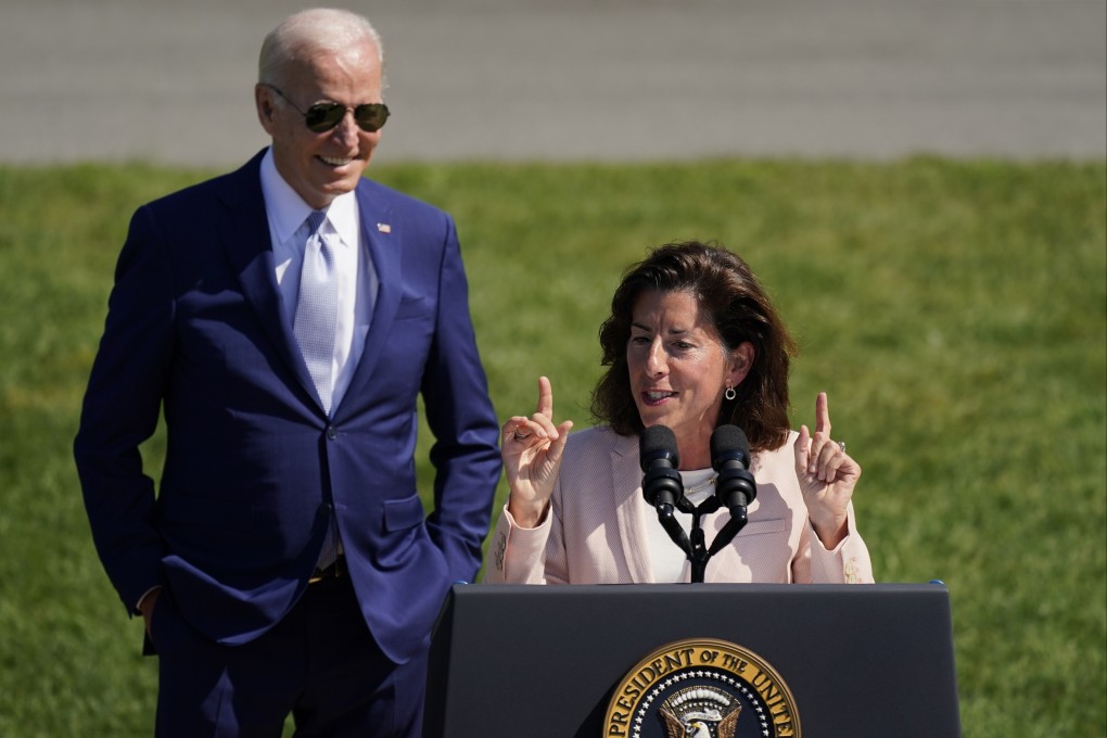 President Joe Biden looks on as Secretary of Commerce Gina Raimondo speaks. Photo: AP