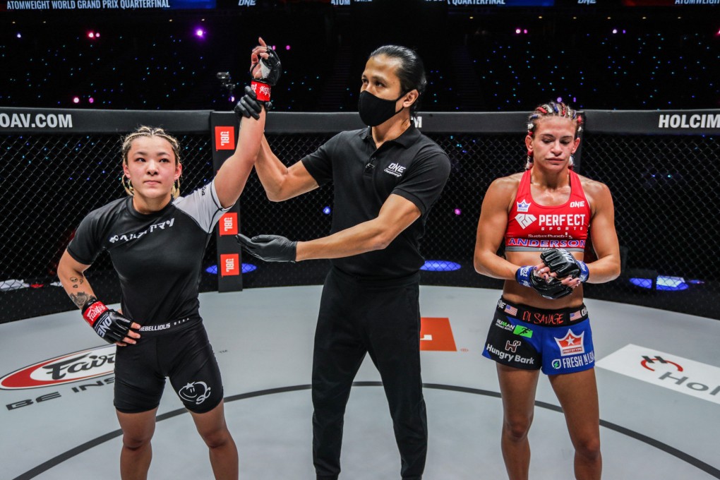 Itsuki Hirata’s arm is raised in victory after a unanimous decision against Alyse Anderson.