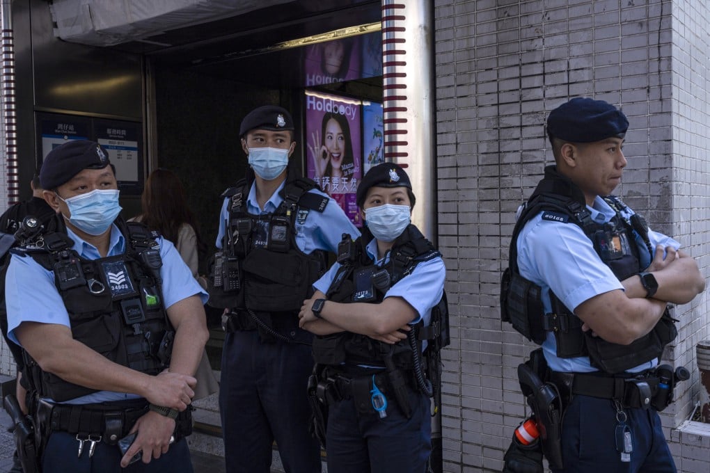 Police officers stand guard where a cancelled march for women’s rights was scheduled to take place in Hong Kong on Sunday. The event would have been the first major civil rights protest in the city since 2020. Photo: AP