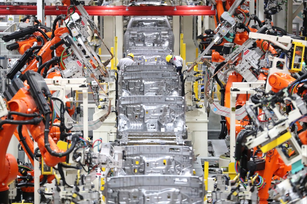Robots conduct welding work at an automobile manufacturing factory in Qingdao in east China’s Shandong province on January 14. In February, China’s manufacturing activity rebounded to its highest in more than a decade. Photo: Xinhua