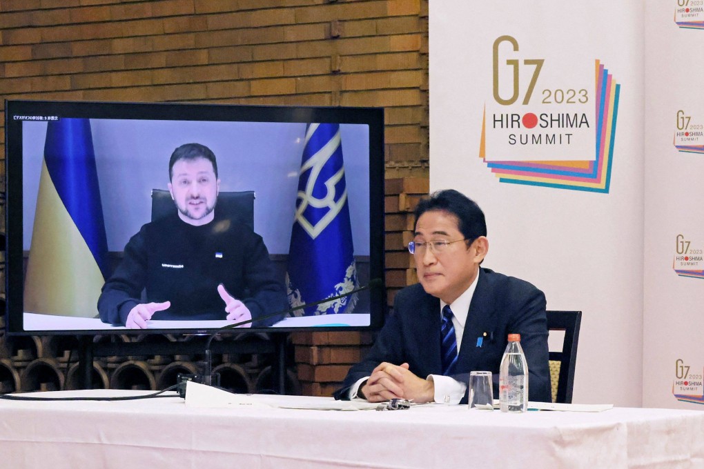 Japanese Prime Minister Fumio Kishida (right) listens as Ukrainian President Volodymyr Zelensky speaks during an online meeting with Group of 7 leaders at the prime minister’s official residence in Tokyo on February 24. Kishida faces a difficult task in pursuing his goal of increasing Japan’s diplomatic and military clout without damaging important relations with China and Russia. Photo: AFP