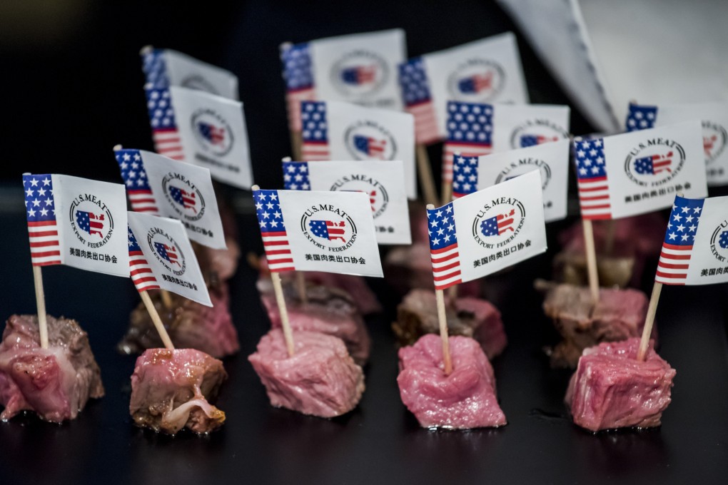 US flags and branding are seen on samples of America beef in Beijing. Photo: AFP