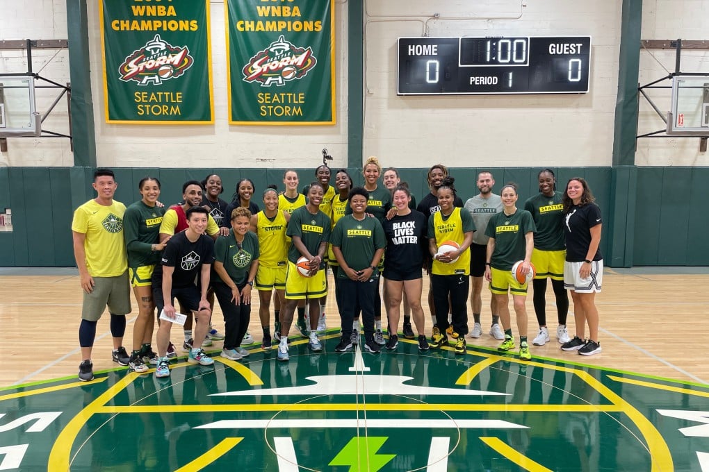 Winson Tam (first from left, front row) has been working with the Seattle Storm since last year. Photo: Winson Tam