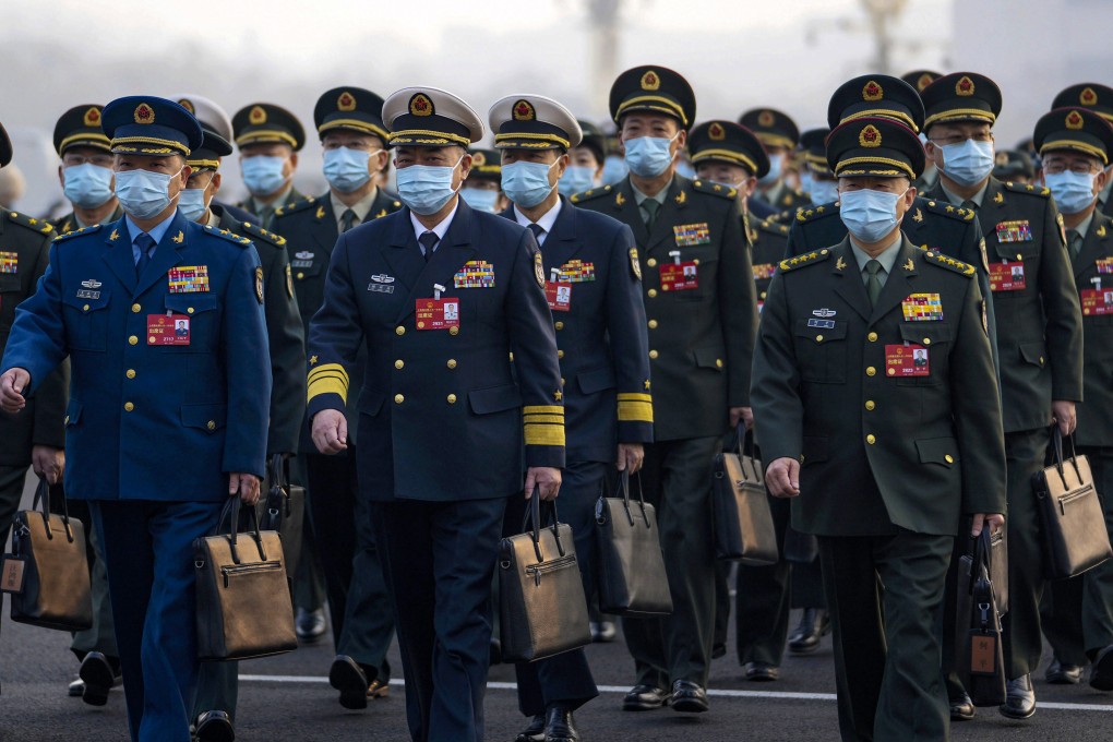 Military deputies arrive for the opening session of the  National People’s Congress in Beijing on Sunday. Photo: AP