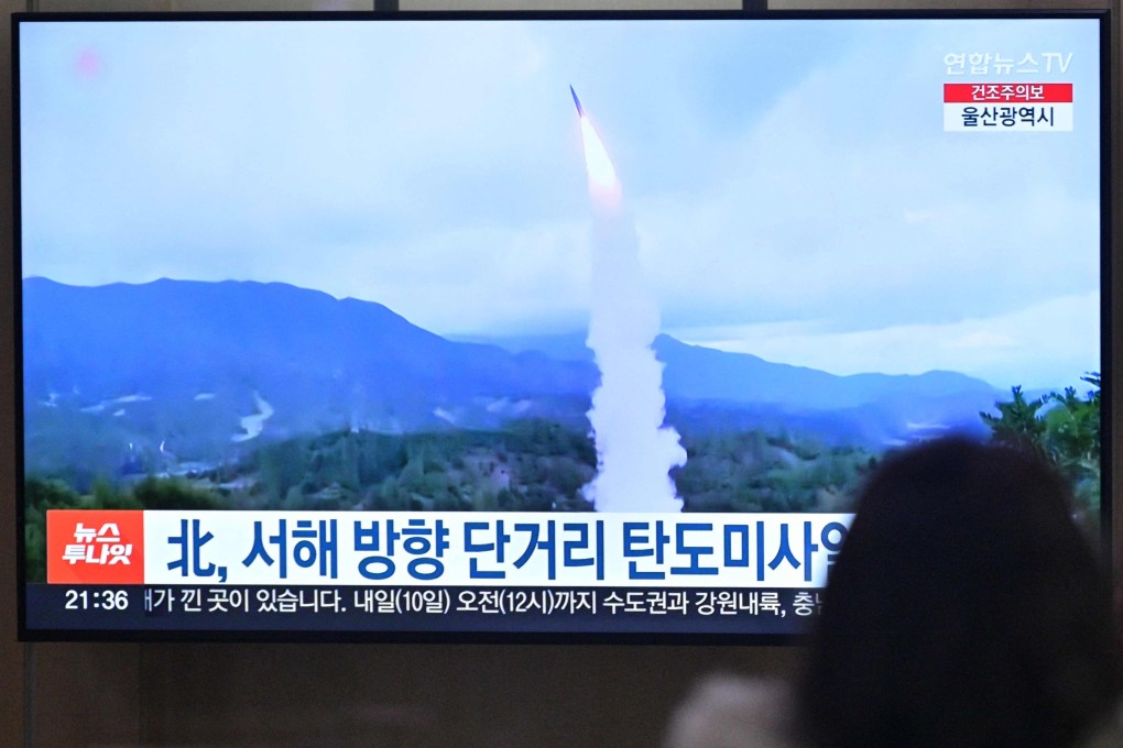 A television showing a news broadcast of a North Korean missile test on Thursday March 9, 2023. Photo: AFP