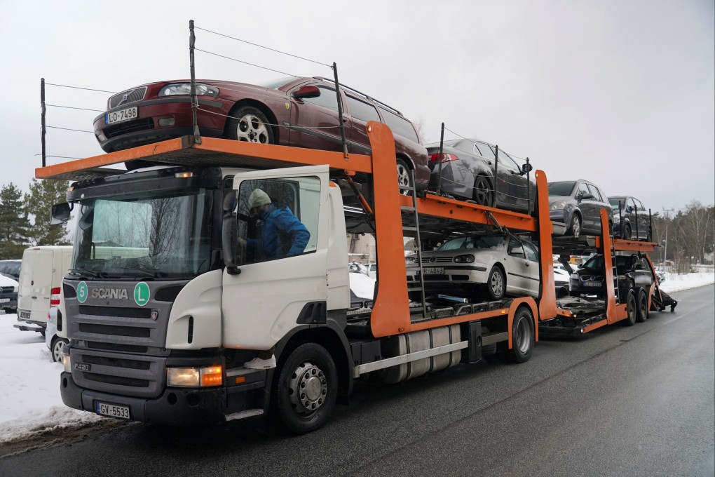 A trailer loaded with vehicles to send to Ukraine is seen in Riga, Latvia on Wednesday. Photo: Reuters