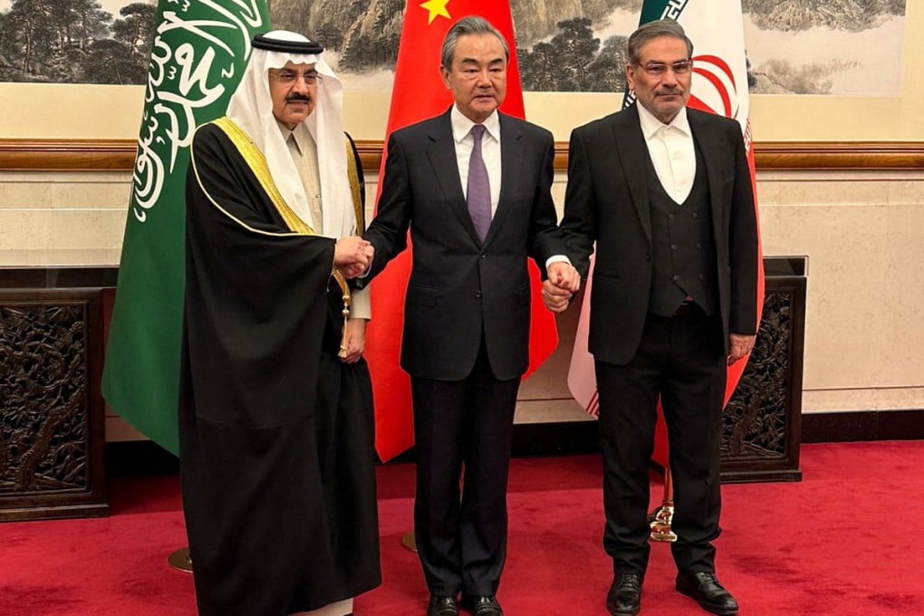 Chinese State Councillor Wang Yi with Saudi Arabia’s National Security Adviser Musaed bin Mohammed Al-Aiban (left) and Iranian Rear Admiral Ali Shamkhani (right) in Beijing on March 10. Photo: Saudi Press Agency/Reuters