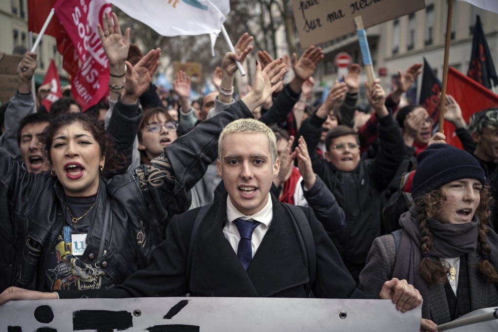 Protesters march against Emmanuel Macron’s controversial pension plan in Lyon, central France on Saturday. Photo: AP