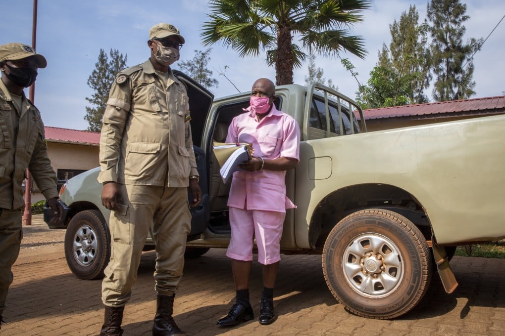 Paul Rusesabagina wears a pink prison uniform as he arrives for a bail hearing at a court in the capital Kigali, Rwanda in 2020. Photo: AP