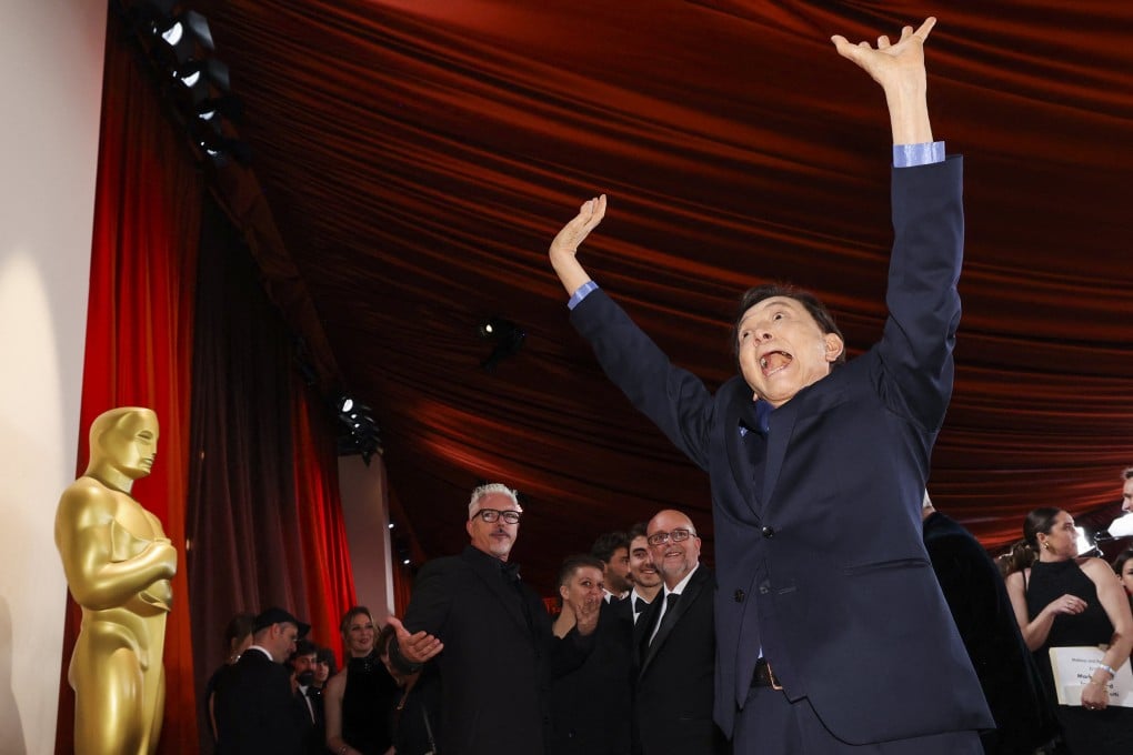 Actor James Hong, 94, gestures on the champagne-coloured red carpet as he arrives for the Academy Awards in Hollywood. Hong is one of the stars of this year’s most nominated film, “Everything Everywhere all at Once”. Photo: Reuters