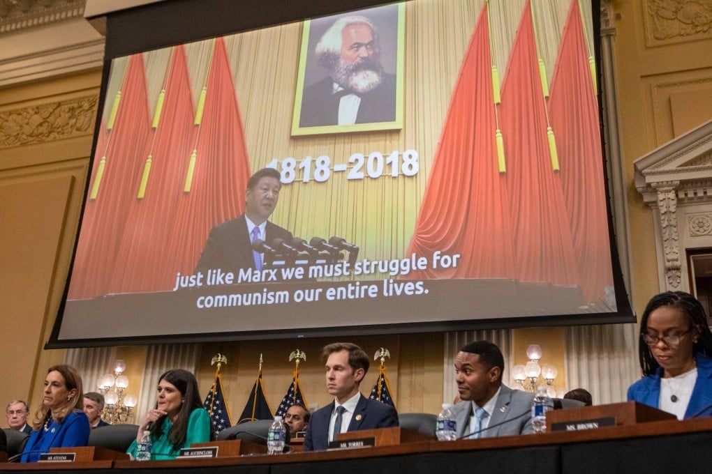 Members of the House Select Committee on the Strategic Competition Between the United States and the Chinese Communist Party watch an introductory video during a hearing in Washington on February 28. Photo: Bloomberg