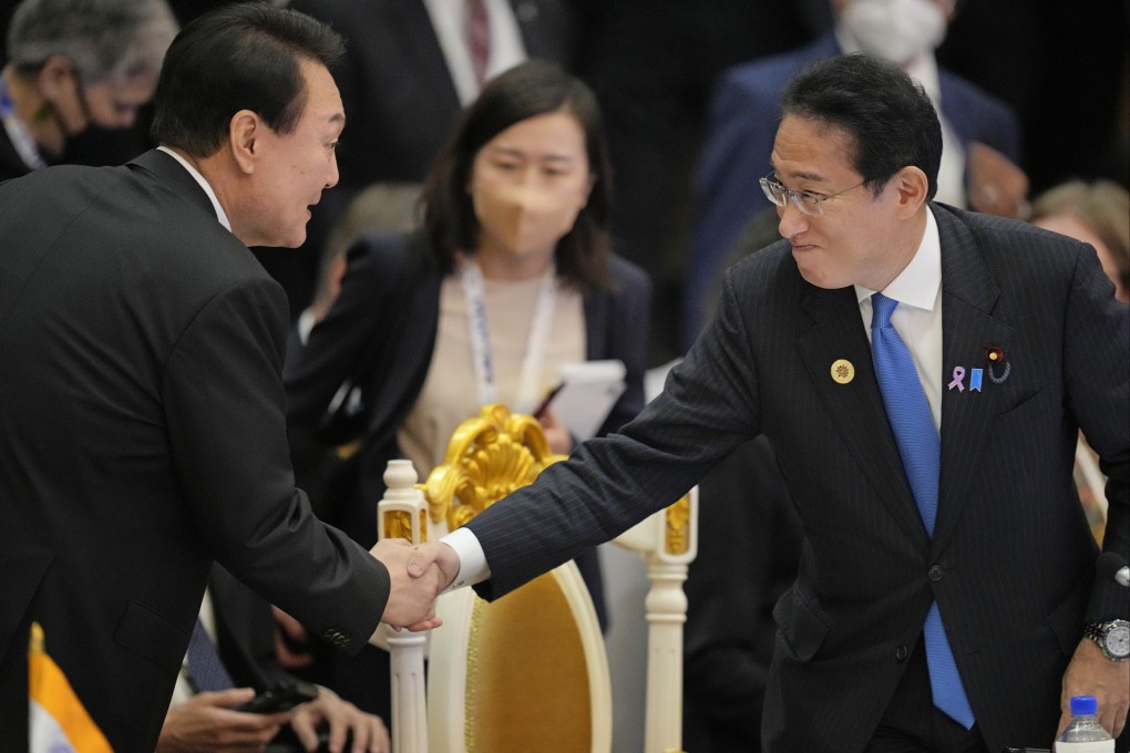 Japan’s PM Fumio Kishida (right) shakes hands with South Korea’s President Yoon Suk-yeol during the Asean-East Asia Summit in Cambodia in November. Photo: AP