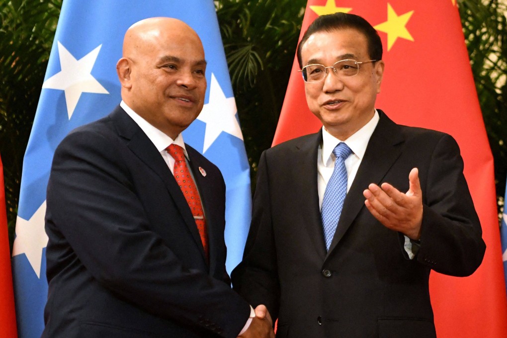 Micronesia’s President David Panuelo shakes hands with China’s former Premier Li Keqiang at the Great Hall of the People in Beijing in 2019. Photo: AFP