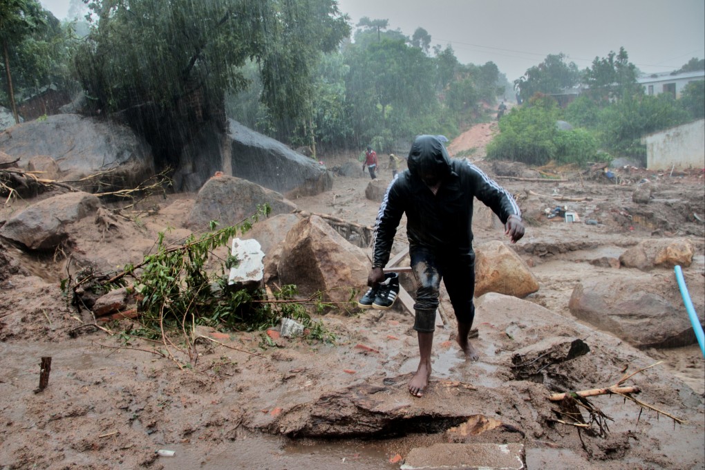 A man walks away from buildings damaged by Cyclone Freddy in Chilobwe, Blantyre, Malawi on Monday. Photo: Reuters