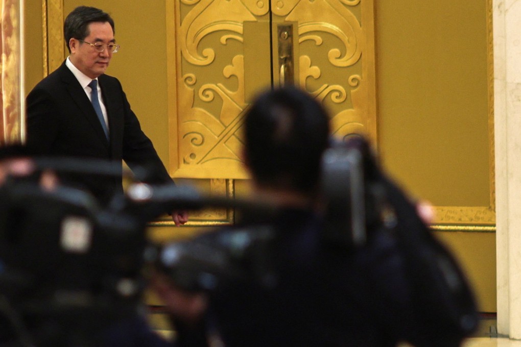 New Chinese Vice-Premier Ding Xuexiang (left) after the closing session of the National People’s Congress in the Great Hall of the People, Beijing. Photo: EPA-EFE