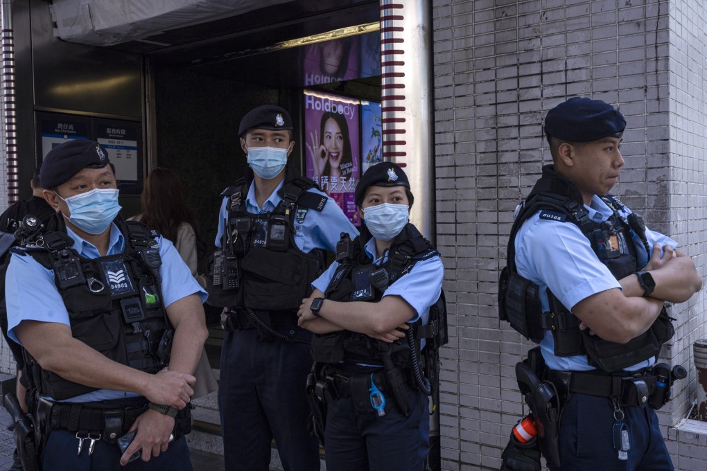 Police officers stand guard where a cancelled march for women’s rights was scheduled to take place in Hong Kong on March 5. Photo: AP