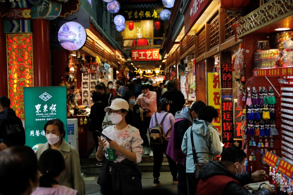 A tourist district in Beijing. Thousands of businesses that expected Chinese consumers to splash the cash in ‘revenge spending’ might be disappointed. Photo: Reuters