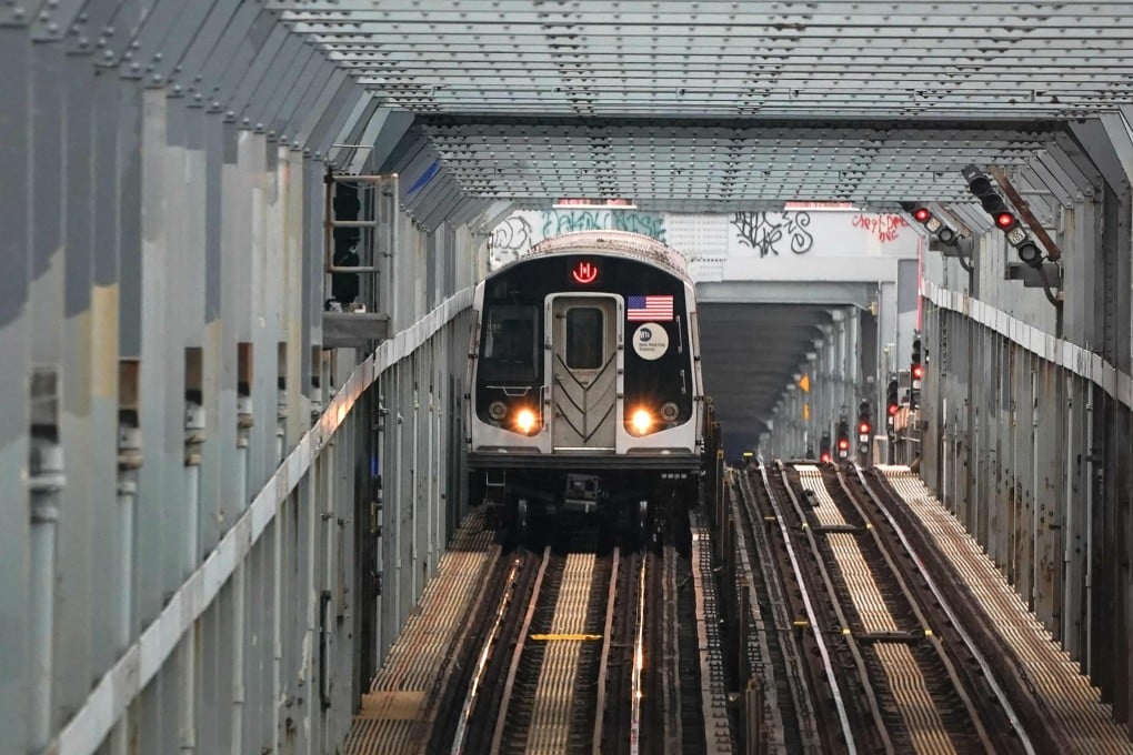 Reports of people traveling outside of cars - including on top of and between carriages - soared from 206 in 2021 to 928 in 2022. Photo: AFP