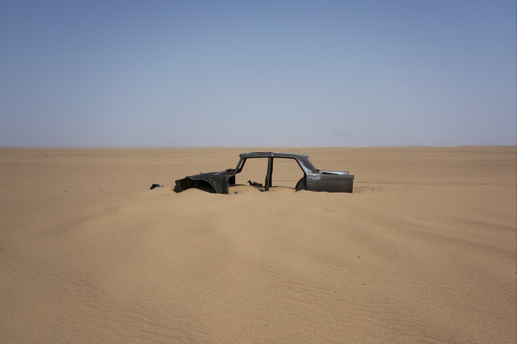The frame of an abandoned car in Niger’s Tenere desert region in the Sahara, a favoured path for migrants. File photo: AP