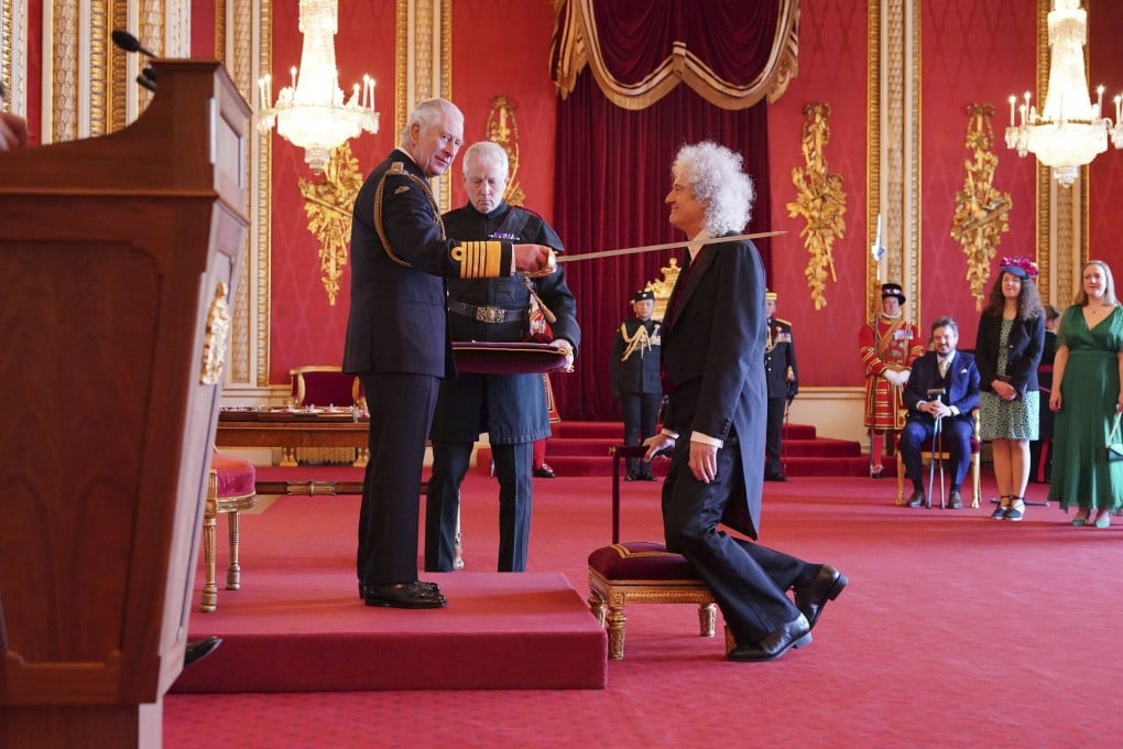 Queen musician and animal rights advocate Brian May musician is made a Knight Bachelor by King Charles at Buckingham Palace in London on Tuesday. Photo: PA via AP