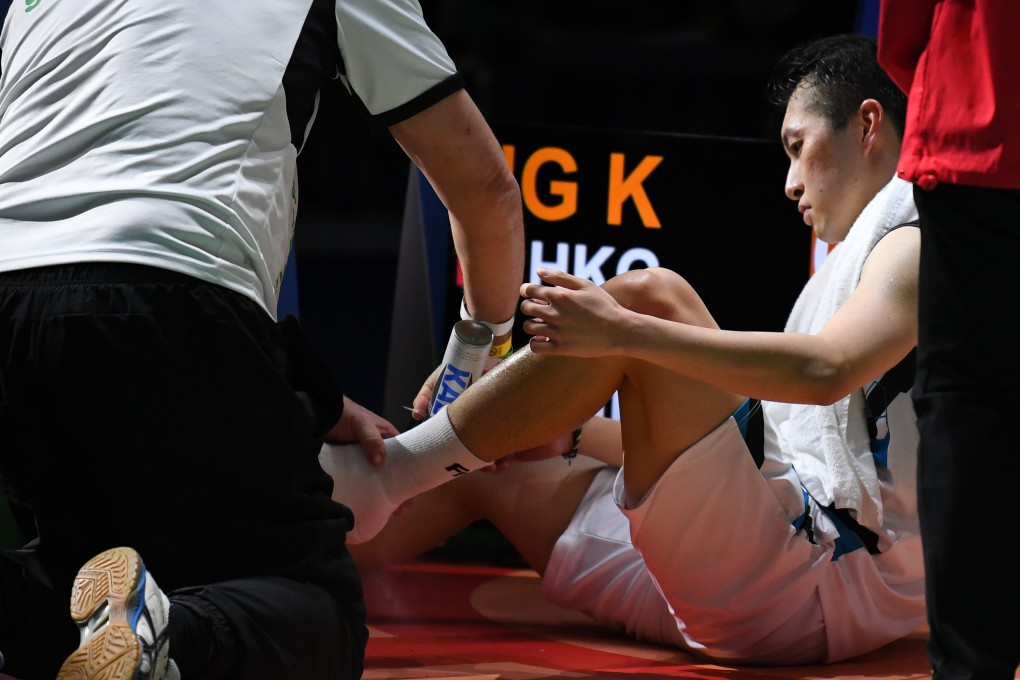 Angus Ng receives treatment during Sunday’s final, also against Li Shifeng. Photo: Xinhua