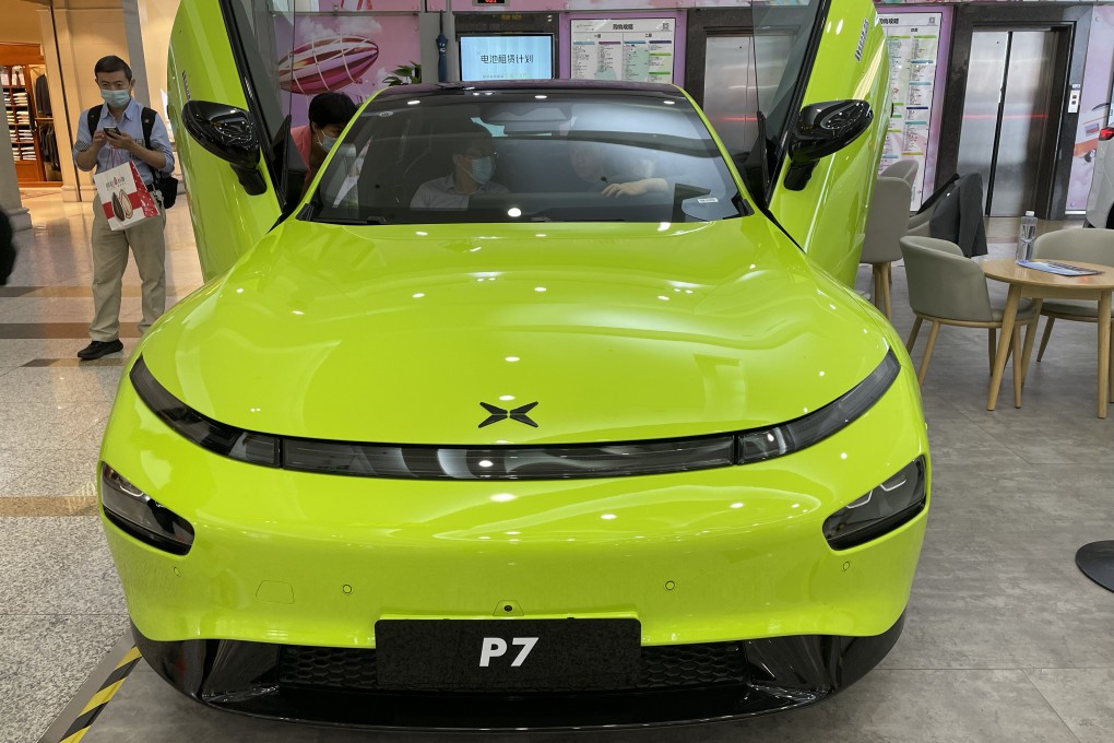 A Xpeng P7 car is displayed at a shopping centre in Beijing. The carmaker is eyeing China’s mass market as demand for premium EVs fades. Photo: Simon Song