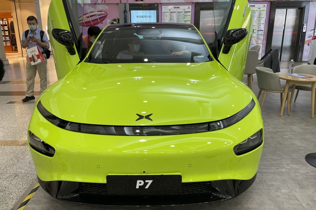 A Xpeng P7 car is displayed at a shopping centre in Beijing. The carmaker is eyeing China’s mass market as demand for premium EVs fades. Photo: Simon Song