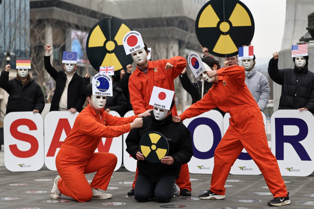 Environmental activists give a performance calling for Japan to call off its decision to release treated waste water from the crippled Fukushima nuclear power station into the sea, during a rally in Seoul, South Korea, on February 28. Photo: EPA-EFE