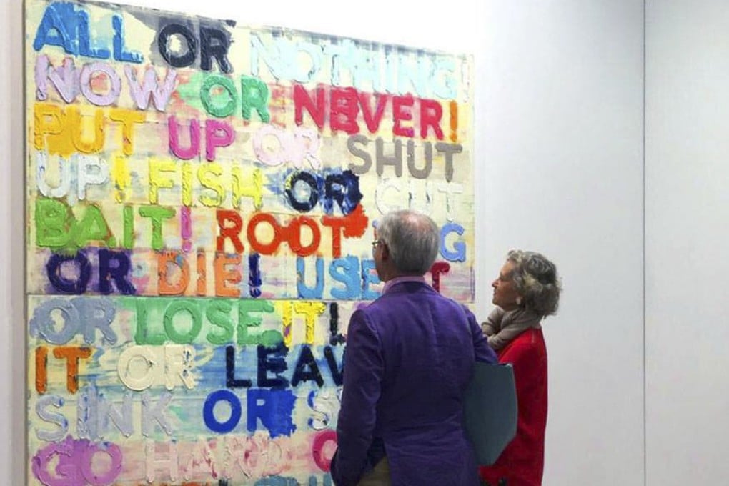 Visitors to Art Basel Hong Kong in 2015 contemplate American conceptual artist Mel Bochner’s “All or nothing”. Text-based art challenges our perceptions of what art is, and our understanding of the meaning of words. Photo: Facebook@Art Basel