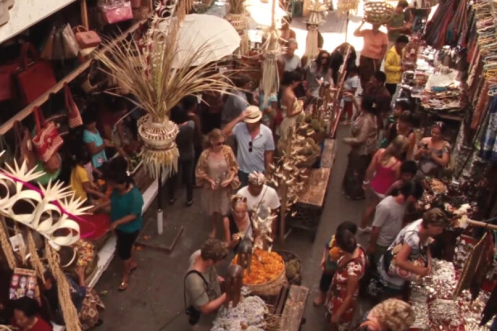 Channel your own Julia Roberts, Morgan Freeman, Andy Lau or Tony Leung Chiu-wai with the SetJetters app, which lets you upload photos of yourself at iconic film locations. Above: Roberts’ character in the market in Ubud, Bali. Photo: Columbia Pictures/SetJetters