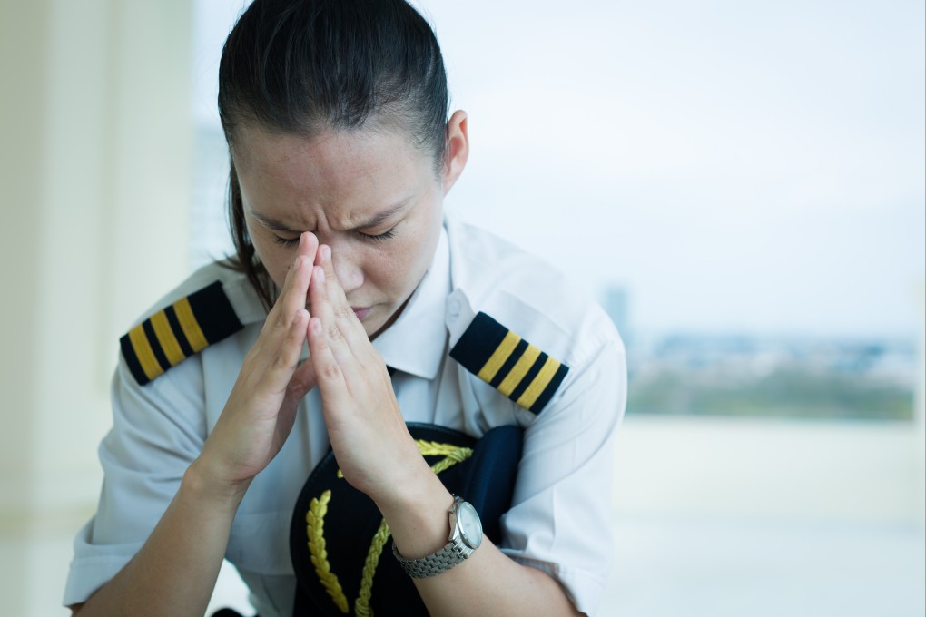 Pilots who flew during the Covid pandemic faced enormous stress, and many in Hong Kong were vilified after two flight attendants breached quarantine. Now they risk being grounded if they seek mental health counselling. Photo: Shutterstock