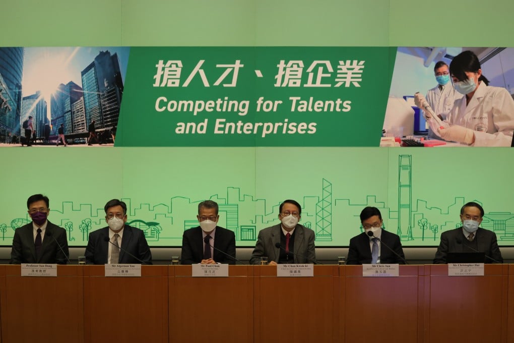 Government ministers of key bureaus, including the Secretary for Innovation, Technology and Industry Sun Dong (far left), meet the press to explain details of the plan to attract talent, at the government headquarters in Admiralty, on December 23, 2022. Photo: Jelly Tse