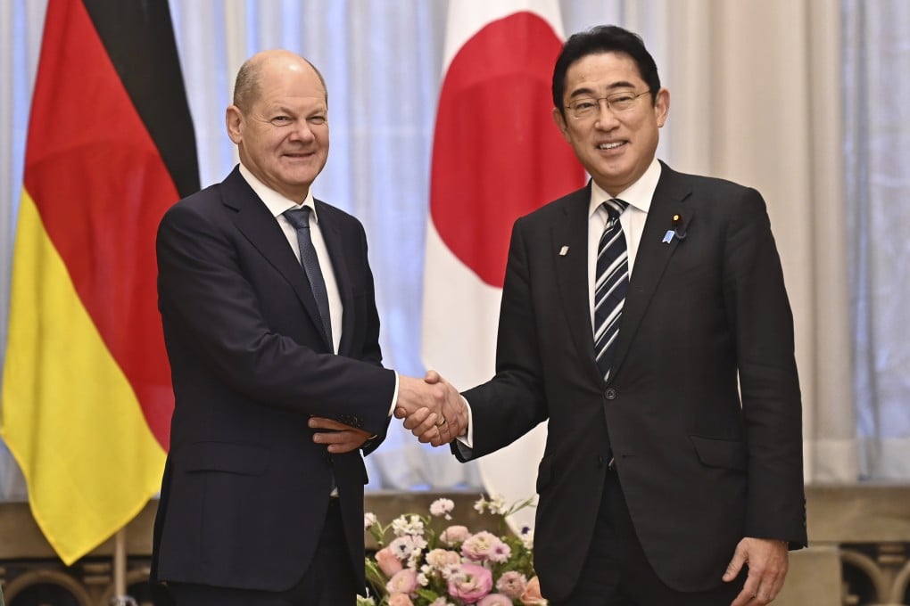 German Chancellor Olaf Scholz (left) and Japan’s Prime Minister Fumio Kishida shake hands at the prime minister’s official residence in Tokyo on Saturday. Photo: Pool via AP